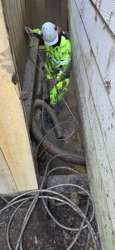 ASB Vac Services crew breaking ground in a confined-space excavation