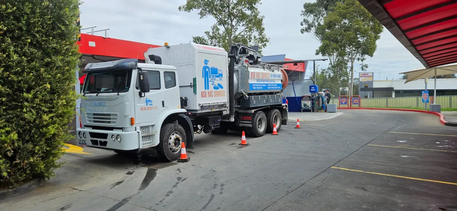 ASB Vac Services vacuum truck set up at a commercial wash bay in Sydney