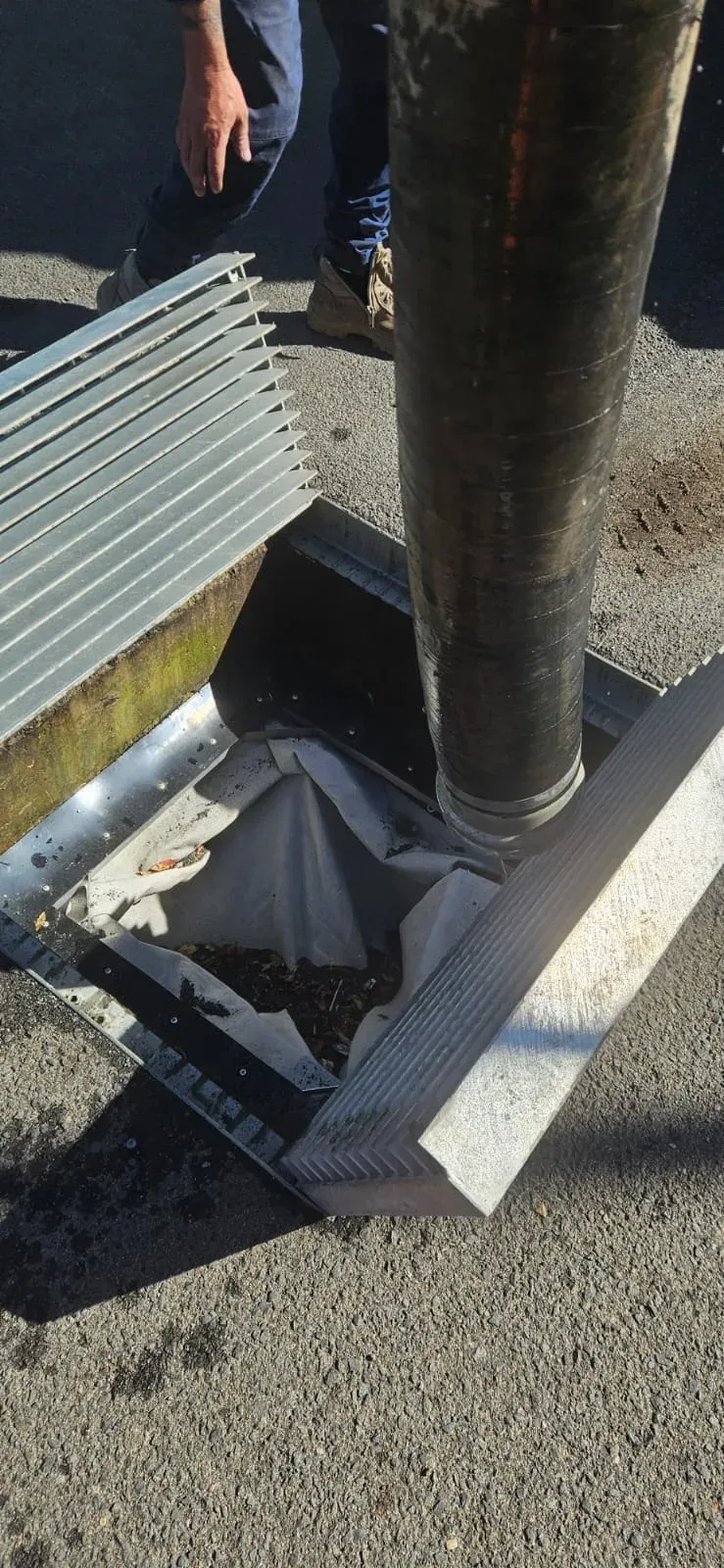 ASB suction hose into a Sydney street stormwater pit — EPA-licensed liquid waste removal